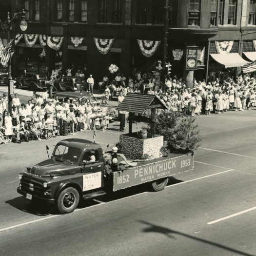 Photo of Pennichuck's parade float in a parade on Main St. in Nashua circa 1953.